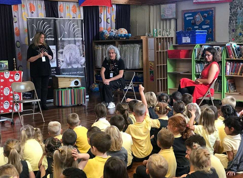 Brian May speaks to children at Year 1 and Year 2 children at Ditton Infant School
