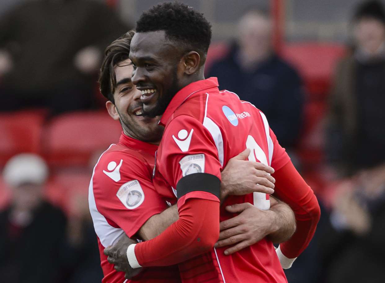Anthony Cook is hugged by Sam Deering after scoring his second goal. Picture: Andy Payton
