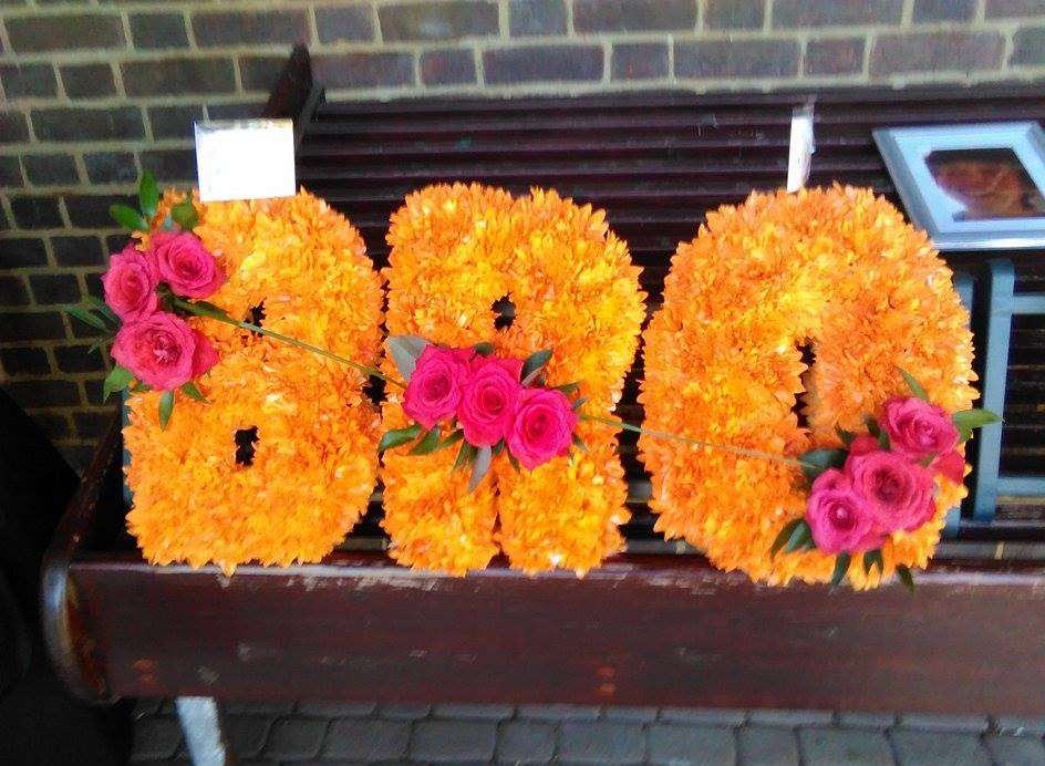 Floral tributes were left by friends and family