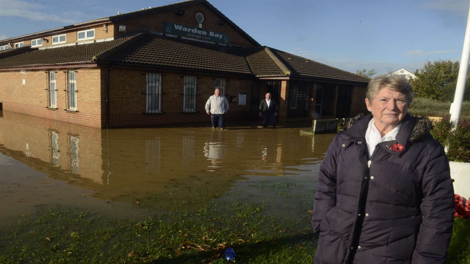 Cllr Pat Sandle outside the flooded Warden Bay Village Hall