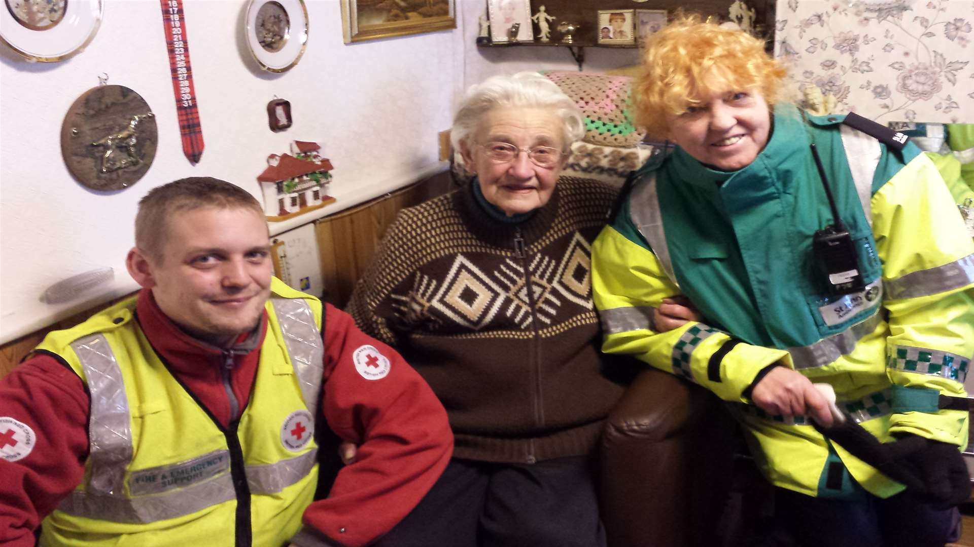 Plucky pensioner Jeanne Tapley, 86, in her flooded home at Bridge with Russell Taylor from the Red Cross and Mary Starrs from the St John Ambulance