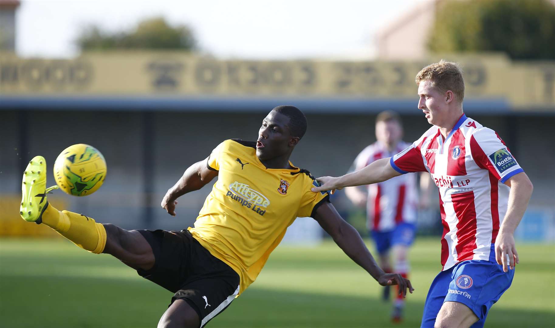 Folkestone's Ade Yusuff stretches for the ball against Dorking Wanderers Picture: Andy Jones