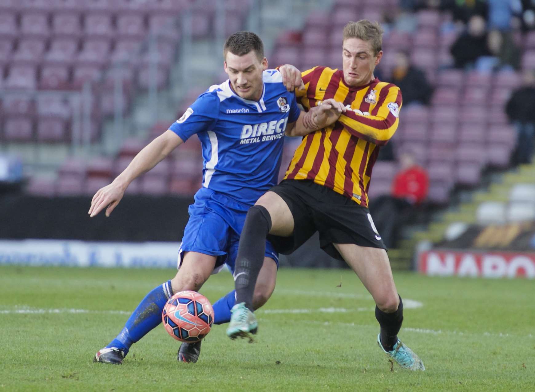 Max Cornhill battles with Bradford's Gary Liddle Picture: Andy Payton