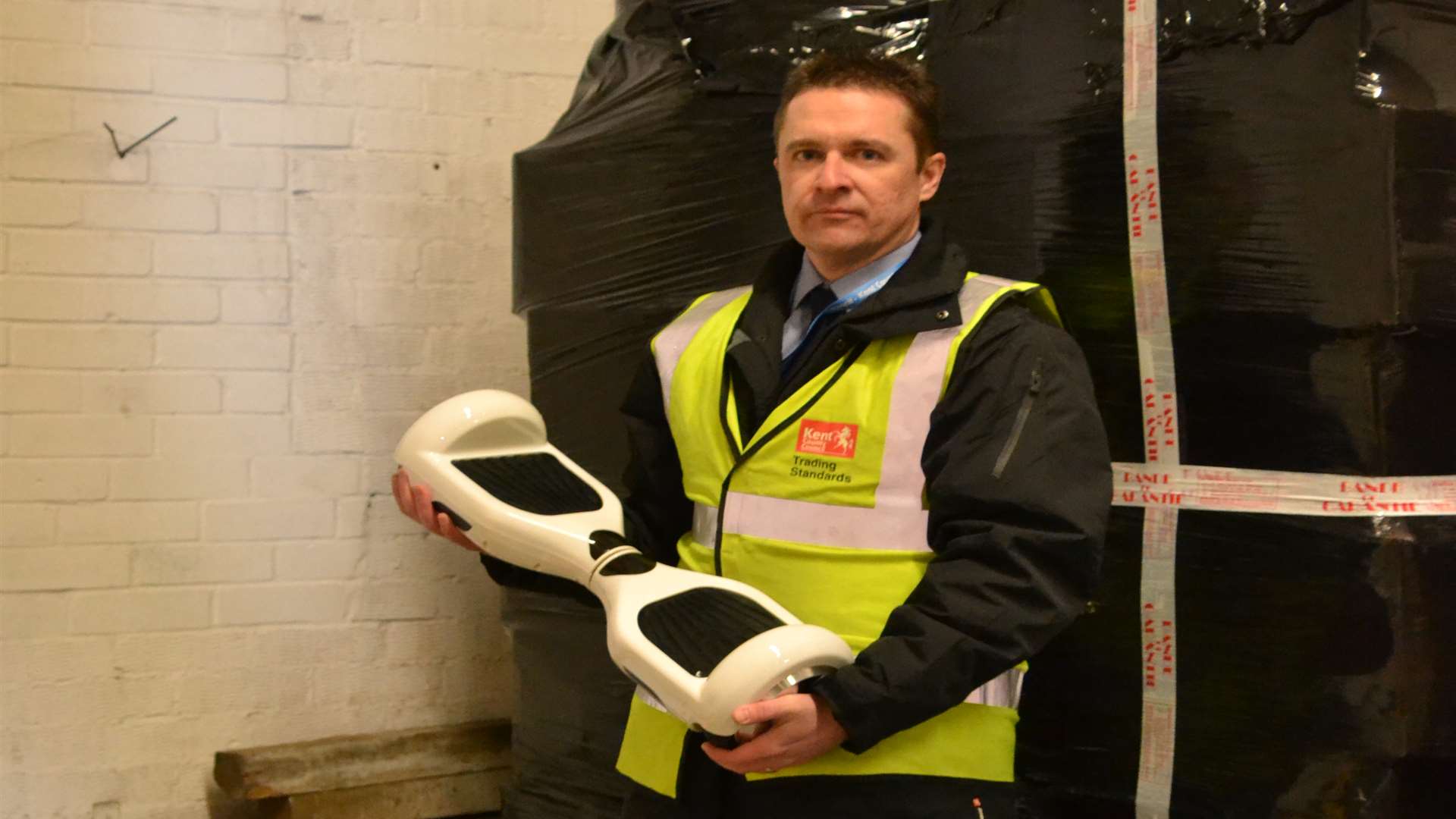James Whiddett of Trading Standards with one of the seized hoverboards. Picture: Kent County Council