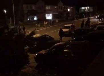 Dozens of people running through Swanley on the night