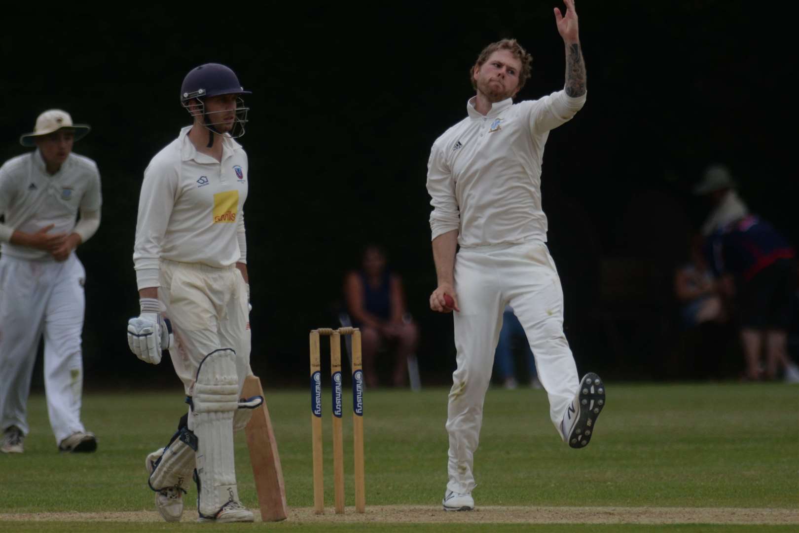 Tunbridge Wells batsman Christopher Williams watches the action as Canterbury's Elliott Lewis takes aim. Picture: Chris Davey