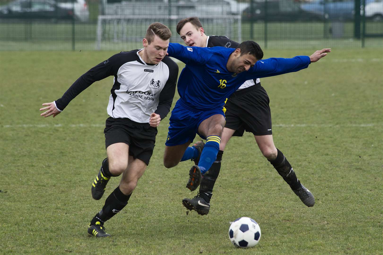 Action from a Gravesend and Dartford Messenger cup final between Guru Nanak (blue) and Princes Park FC, at Fleet Leisure, Gravesend