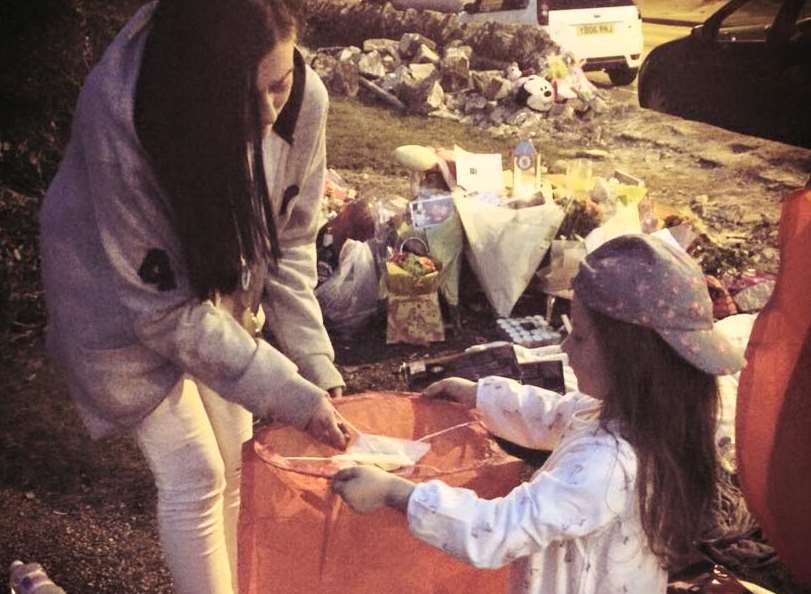 Lauren and Lily released a lantern in memory of Michael on Monday.