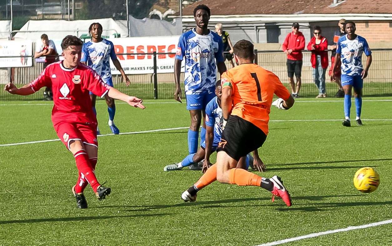 Midfielder Liam Gillies scores one of his two goals in Whitstable’s FA Cup weekend 3-2 loss to Wingate & Finchley. Picture: Les Biggs