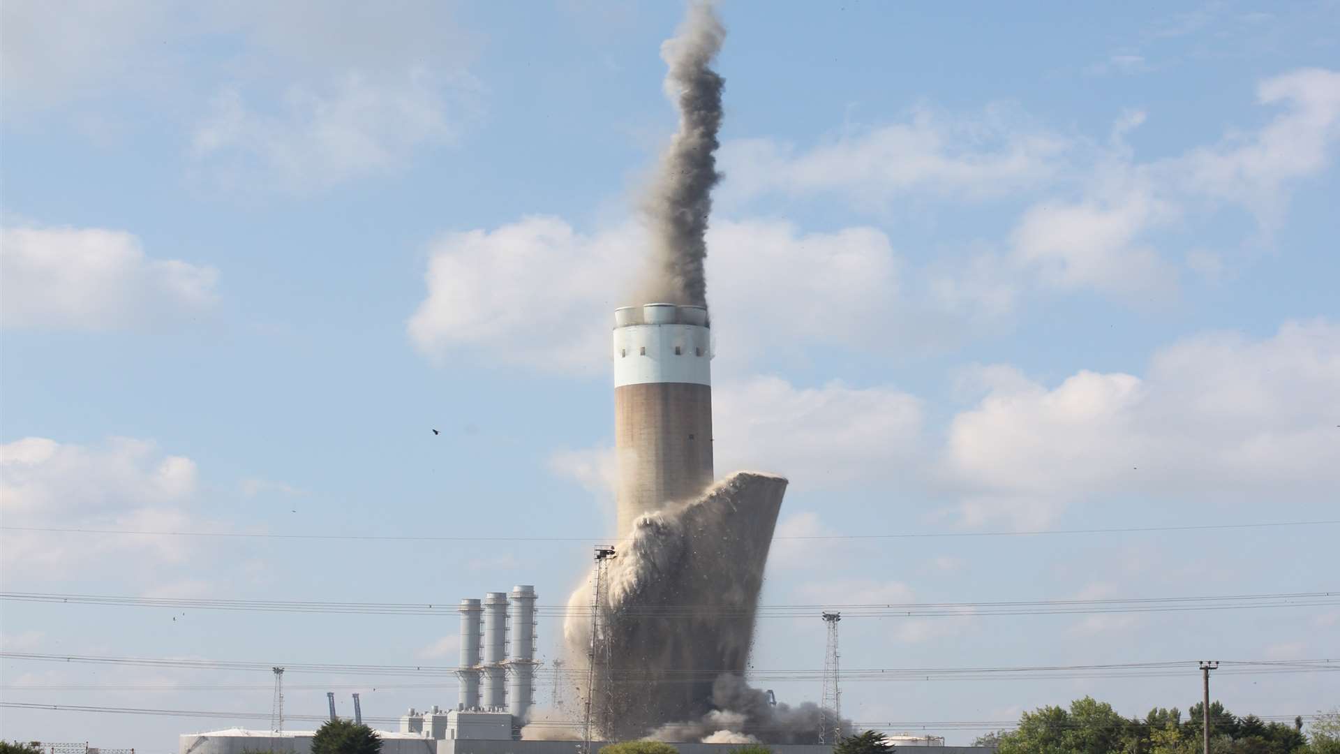 The chimney at Grain Power Station coming down