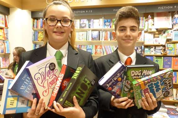 Katelyn Humphrey and Denis Mehalla from Spires Academy select books at Waterstones in Canterbuty