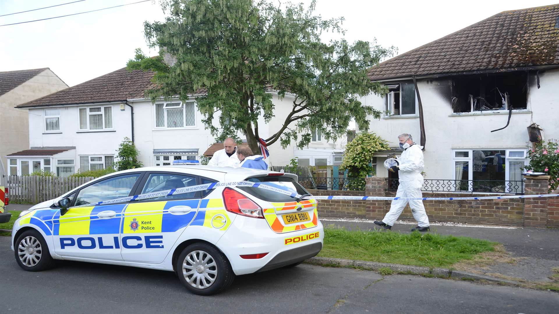 Forensic investigation teams at the scene of the fire in Sussex Road