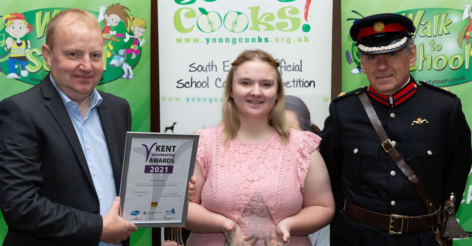 Rob Crook of Pfizers presents Lacie Ingram with her Overall Kent Young Person Volunteer of the Year award, with Deputy Lord Lieutenant of Kent Paul Auston Picture: Countrywide Photographic