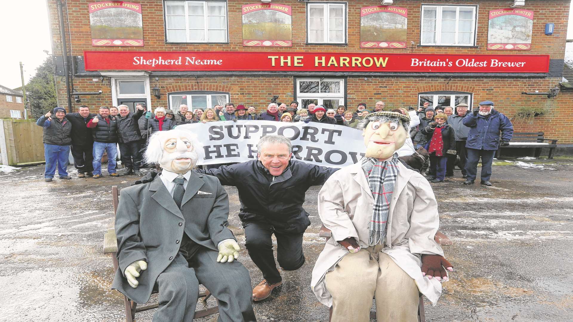 Chris Porter, two famous faces from the Muppet Show who helped promote the campaign and villagers who have saved the Harrow pub in Stockbury. Picture: John Westhrop
