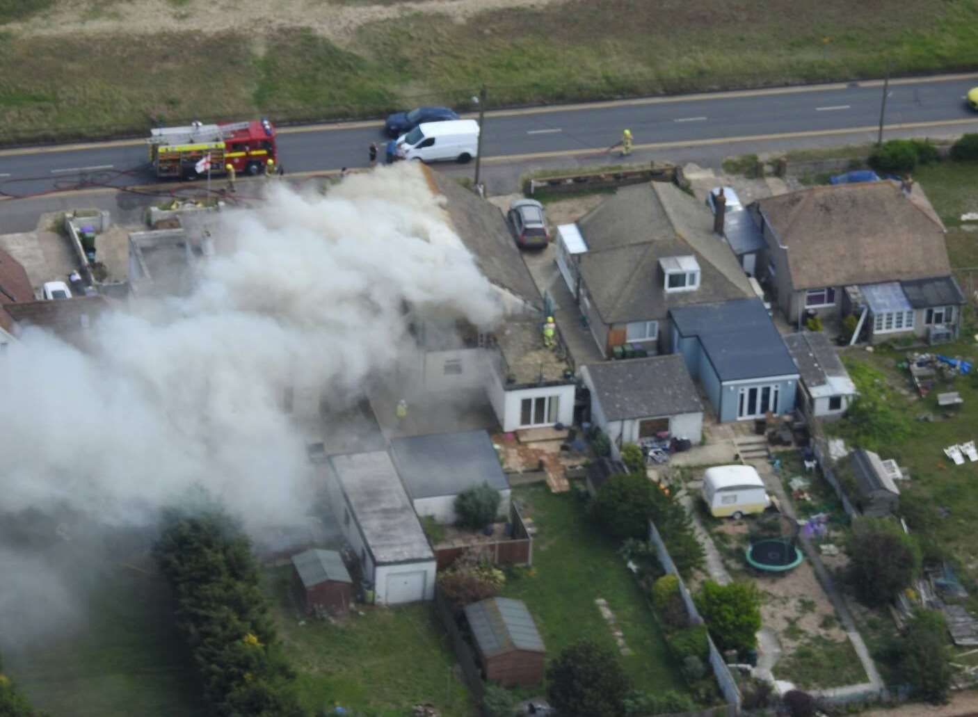 A drone captured smoke billowing from the house