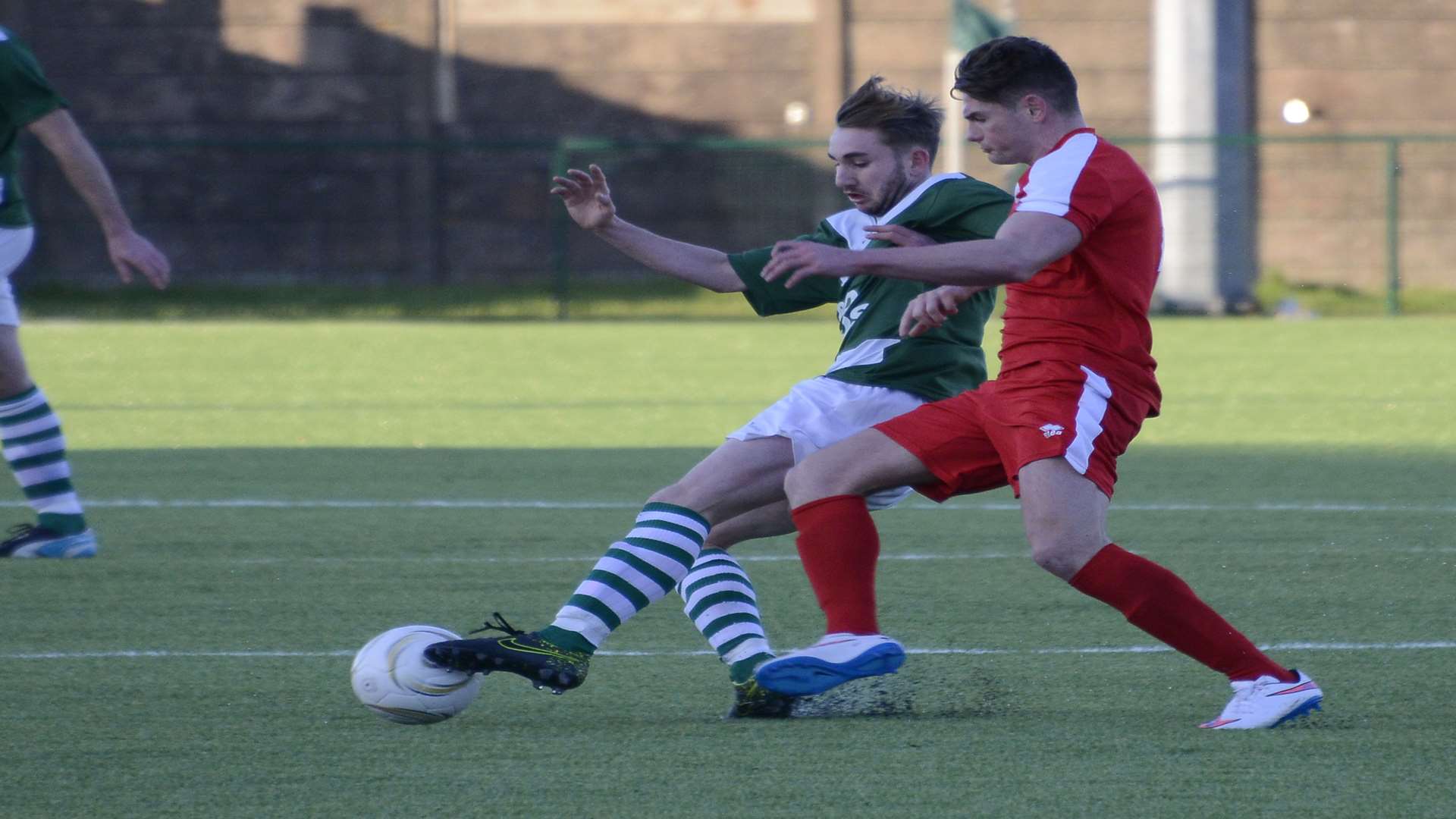 Mikey Dalton holds off a Dunston player during the 1-1 FA Vase Fifth Round draw at Homelands
