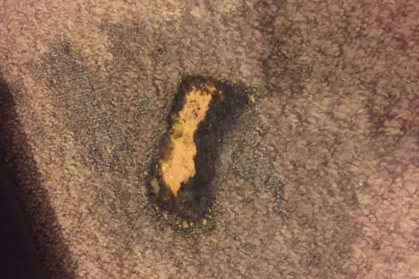 The fire created a hole in the family's carpet