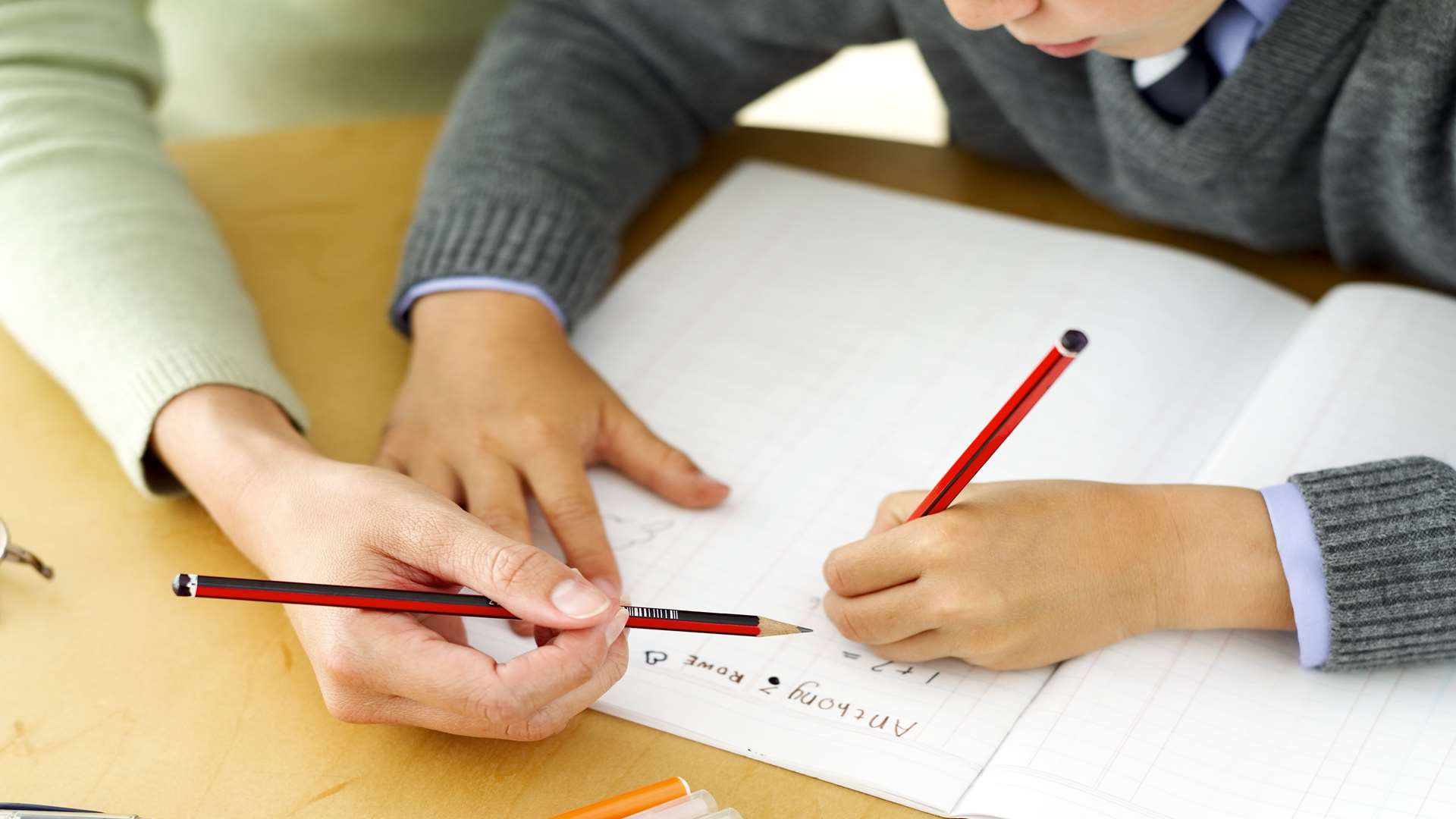 A pupil is taught at a school. Thinkstock Image Library.