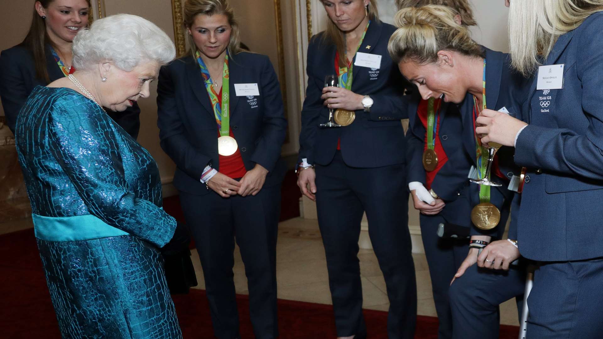 Susannah Townsend and the GB Hockey heroes meet Her Majesty the Queen. Picture: Yui Mok/PA Wire