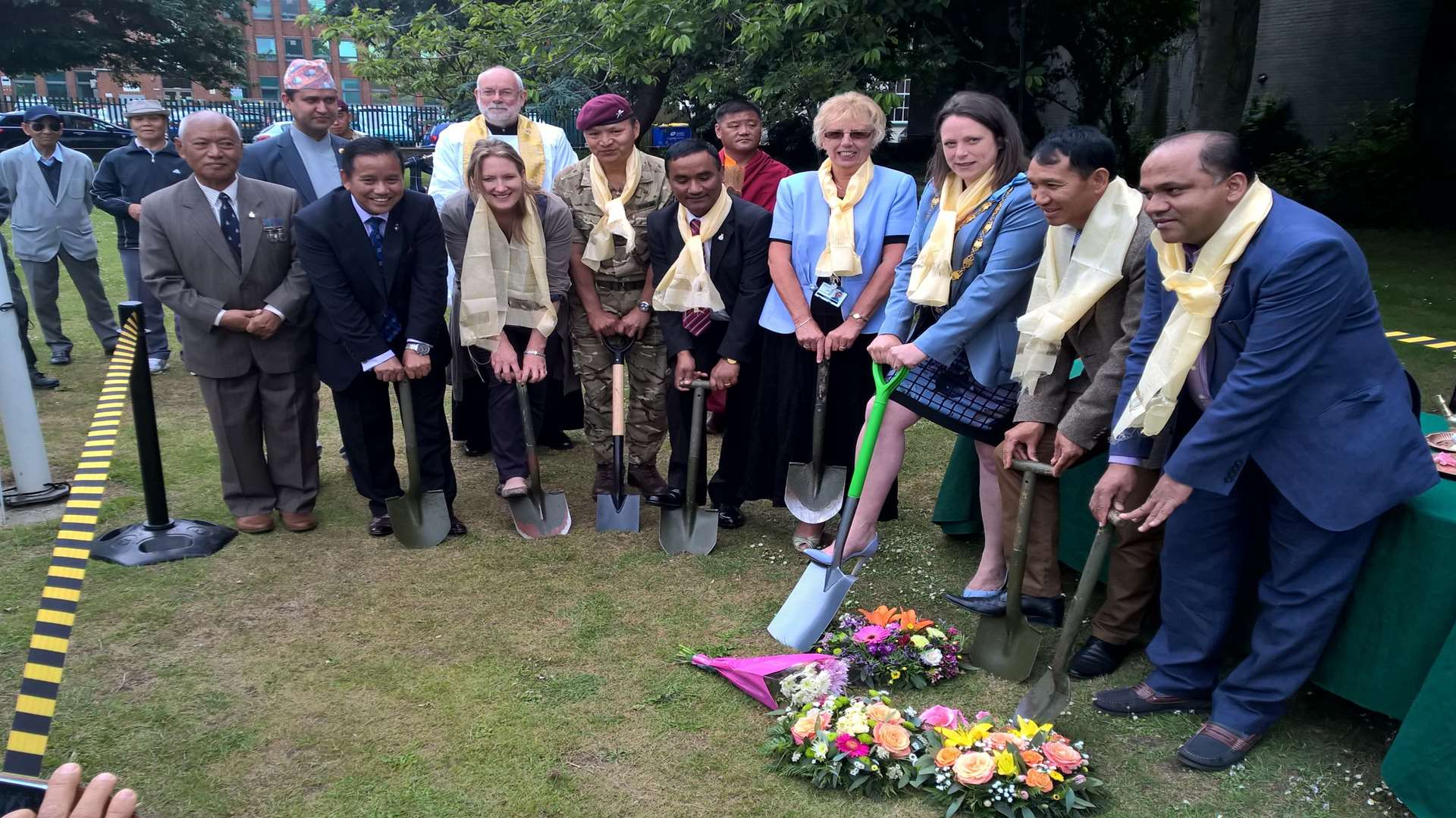 Ex-Gurkhas and members of the Nepalese community join dignitaries to dig the first ground for the new Gurkha memorial. Picture courtesy of Ray Johnson