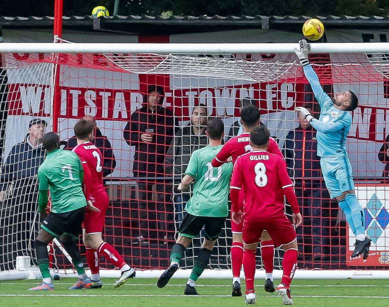 Goalkeeper Dan Eason gets up and attempts to guide the ball over the crossbar. Picture: Les Biggs