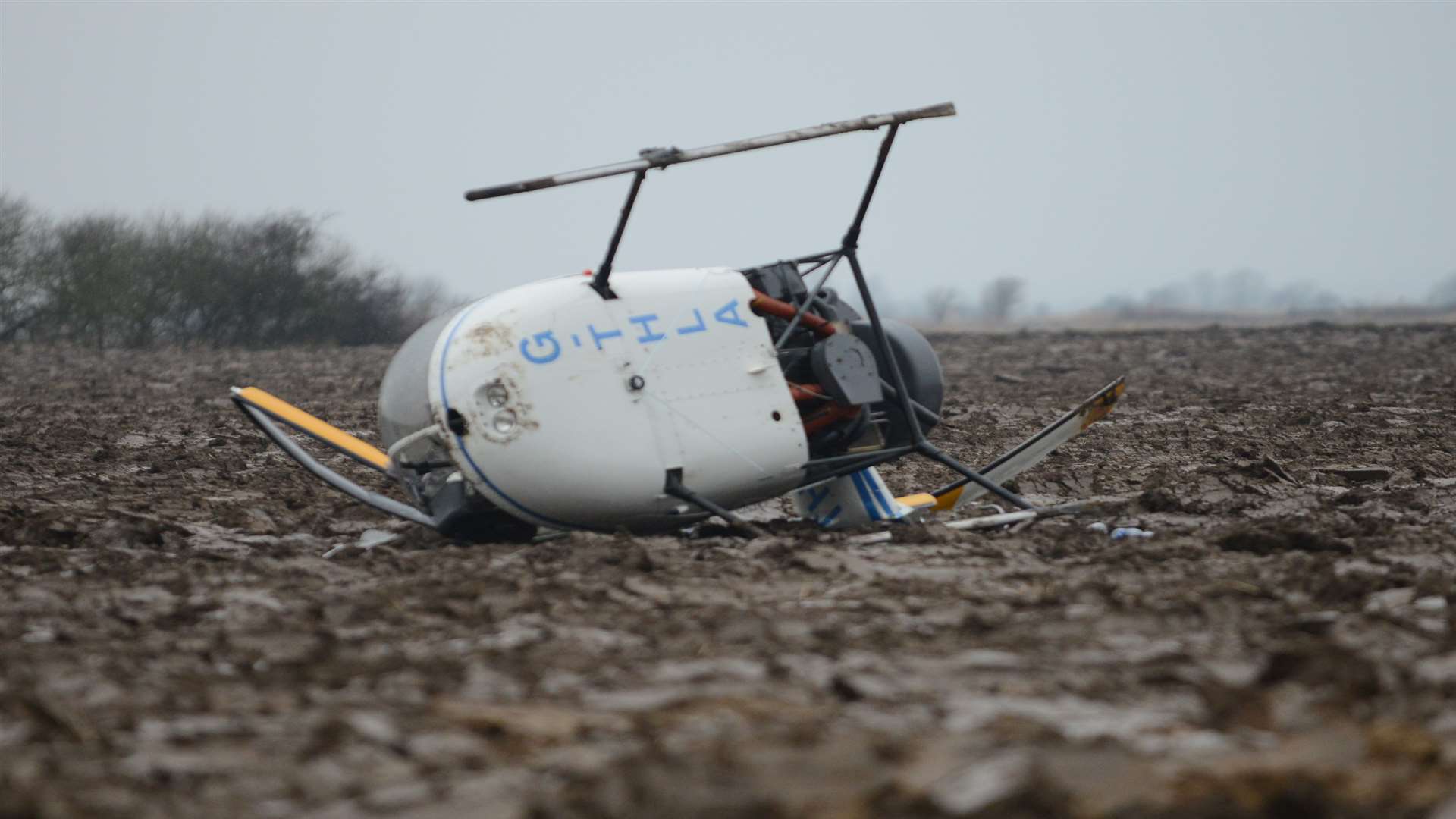 The Robinson R22 two-seater aircraft after in crashed in a field. Picture: Gary Browne