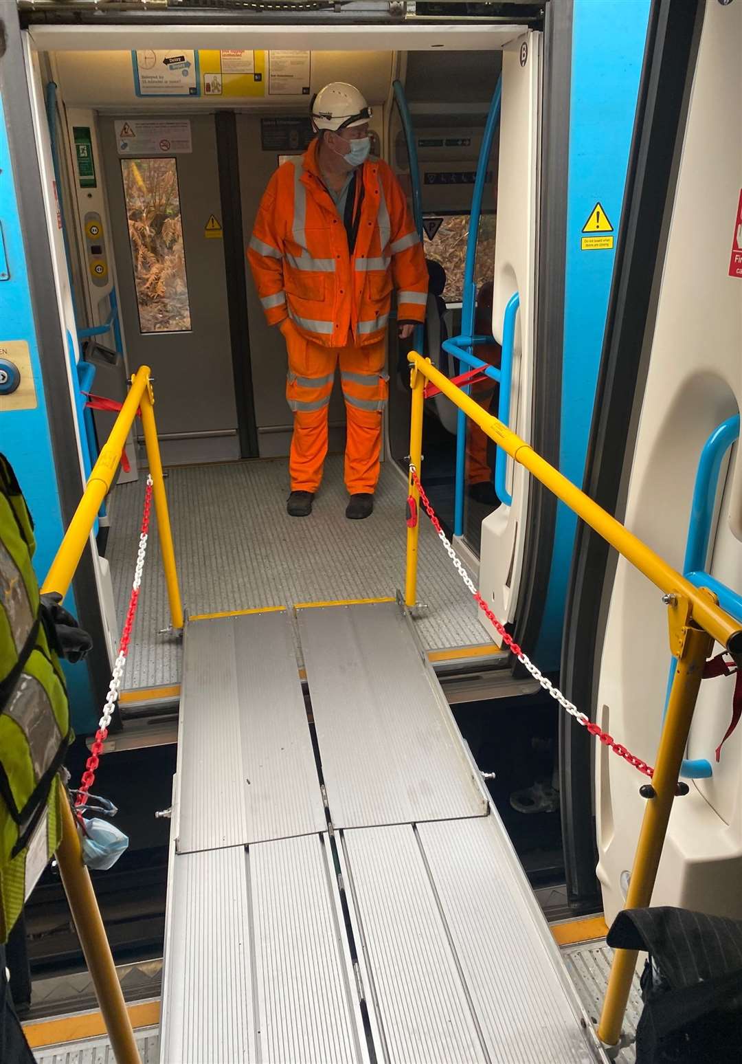 Engineers help evacuate commuters trapped on a train after it hit a fallen tree on the track at Battle. Picture: Network Rail