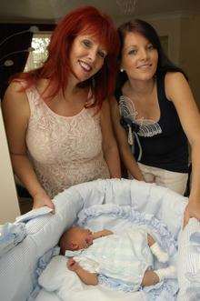Virginia Howes (left) helped deliver daughter Sophie Harrell's baby Jesse