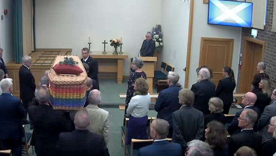 Sadie Williams' casket arrives at the chapel, adorned with a thistle