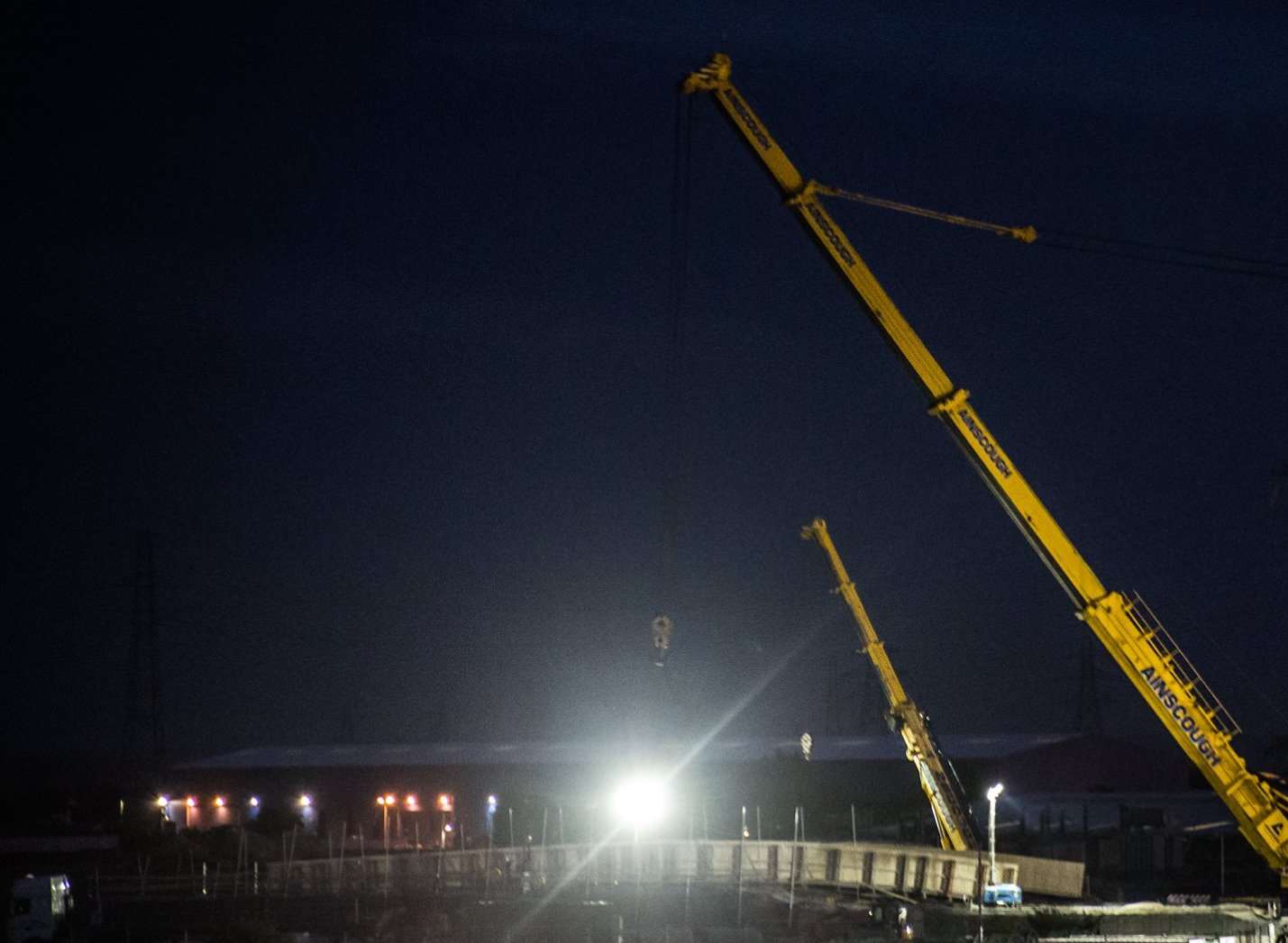 Going up - giant crane lifting parts of the new bridge into position. Picture: Andy Dell