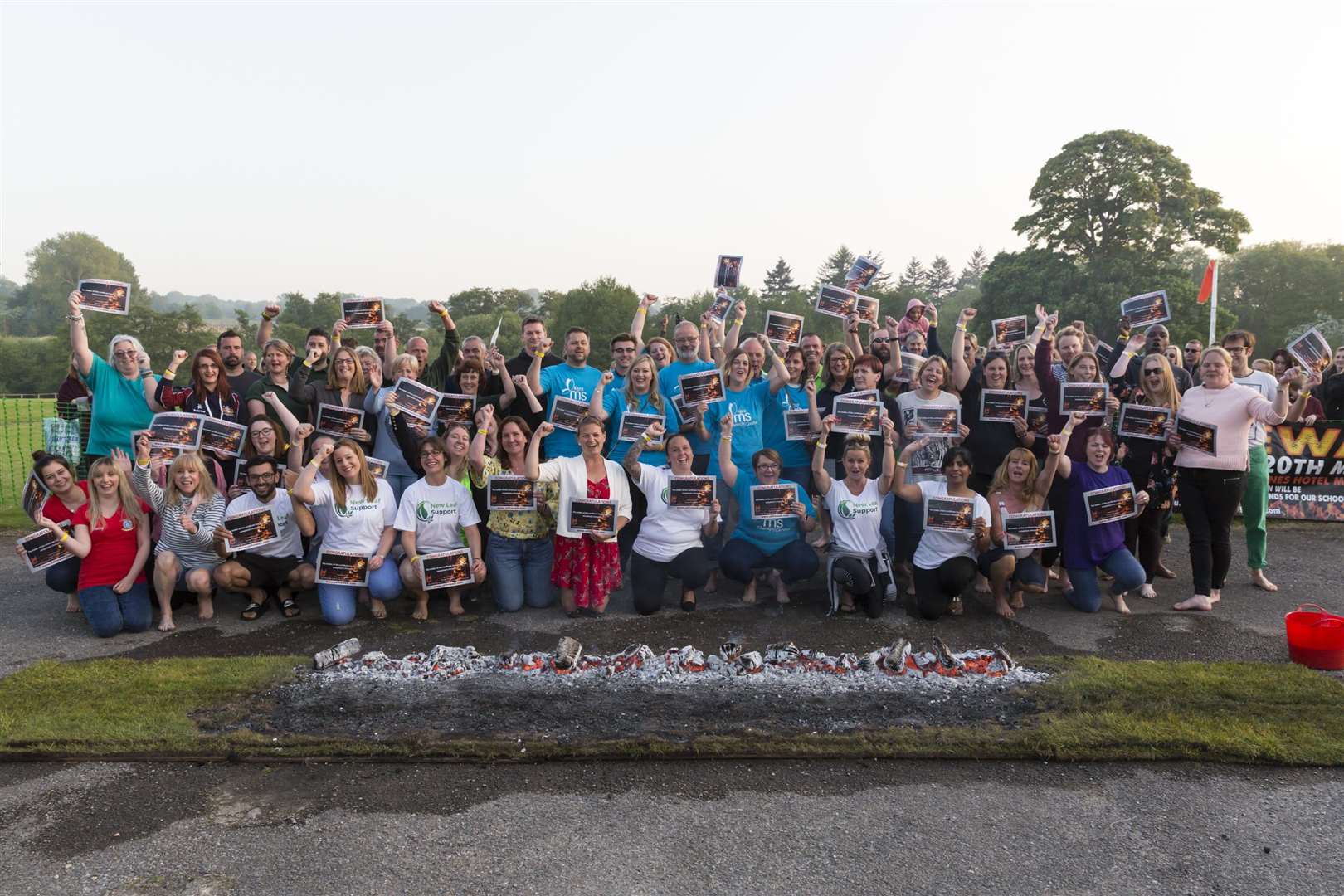 Participants celebrate their achievement at Buster's Firewalk, staged by the KM Charity Team at the Great Danes Mercure Hotel, Maidstone. (2130475)