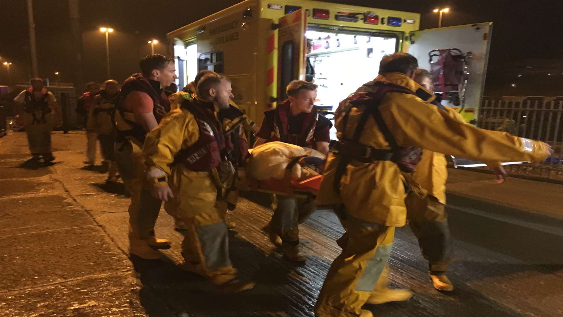 Lifeboat crewmen help rescue the stricken cruise ship passenger. Picture: RNLI