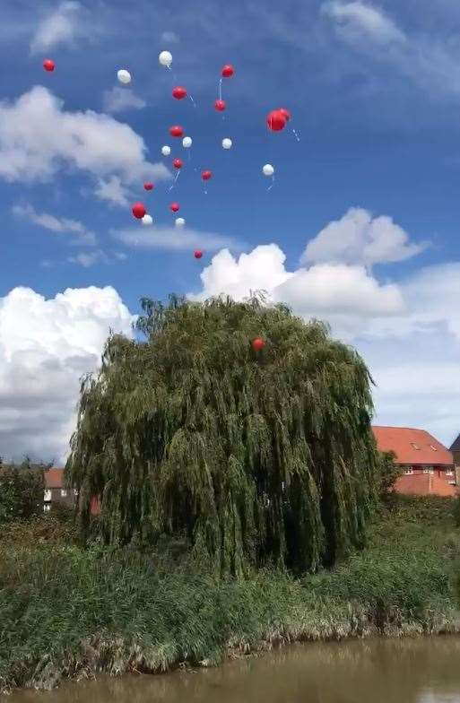 Red and white balloons were released over the River Stour in memory of Lucas Dobson Picture: From a video by Kirsty Furze