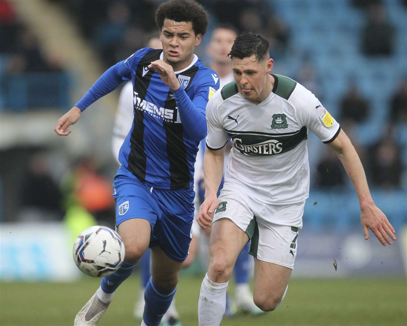 Gillingham's Tom Dickson-Peters challenges for the ball against Plymouth. Picture: KPI