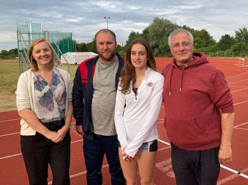 Charlotte Henrich, second right, with coaches Claire Battersby, Ben Small, and Carlo Monticolombi