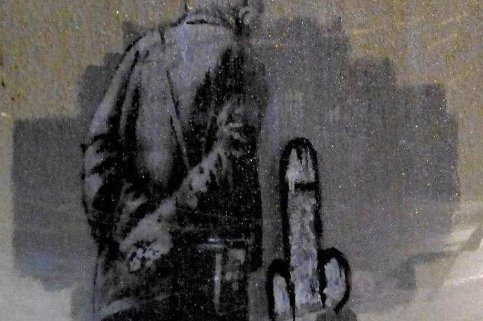 The Banksy with the first set of graffiti - now believed to have been done by Banksy himself!