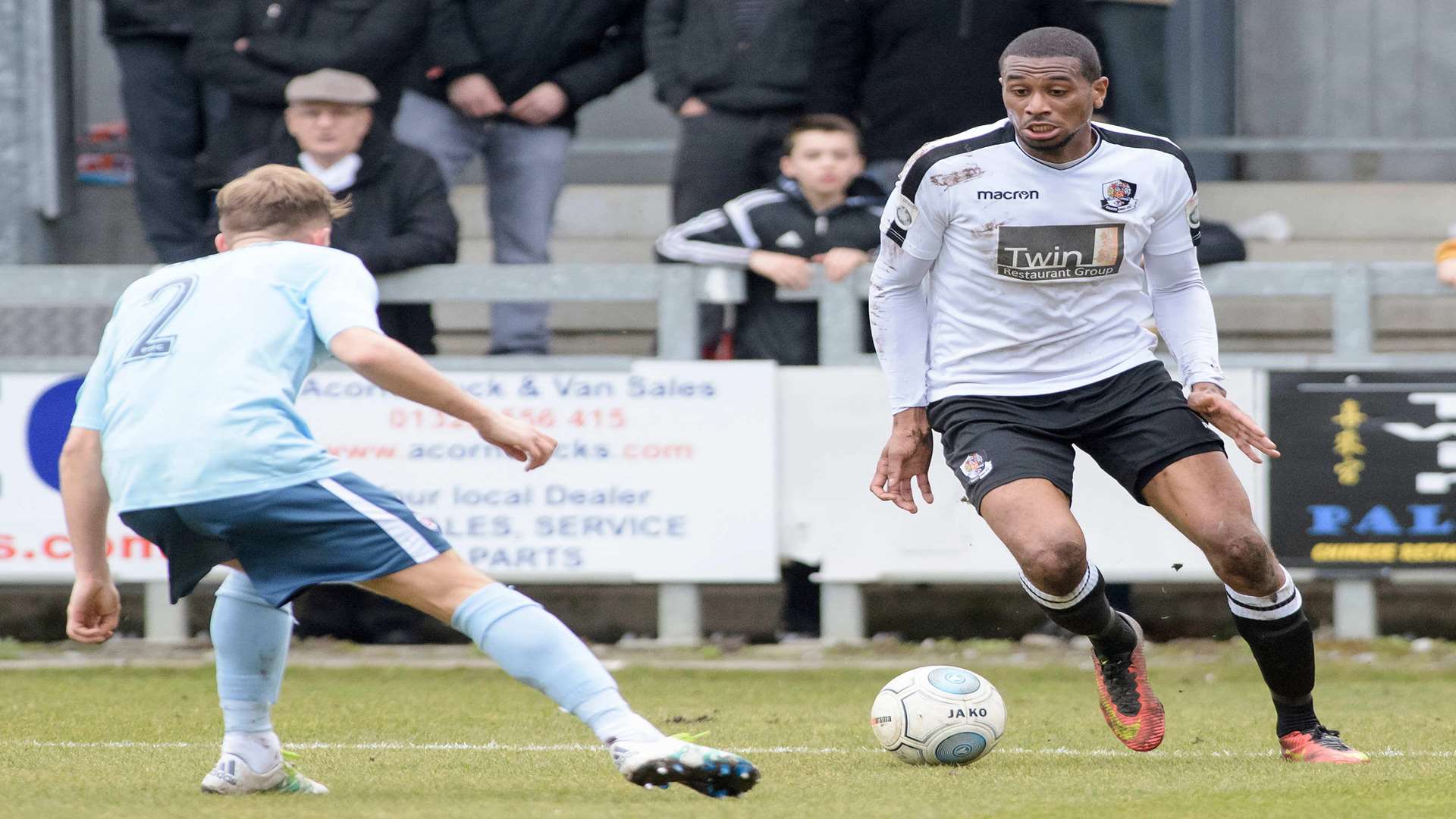 Dartford's Danny Mills runs at Corby Moore of Poole. Picture: Andy Payton