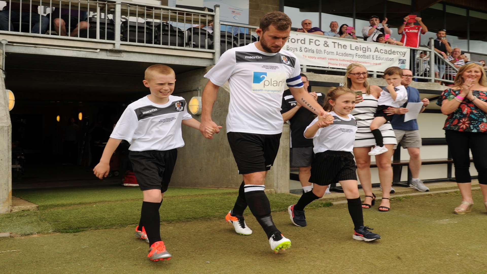 Ryan Hayes walks out with his children Freddie and Madison Picture: Steve Crispe
