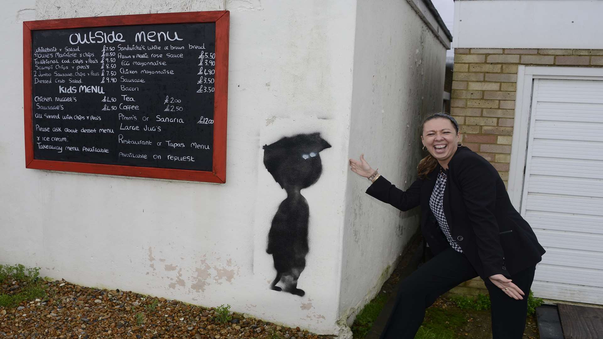 Sotorio's 103 restaurant manager Agnes Stephens views the possible Banksy image.