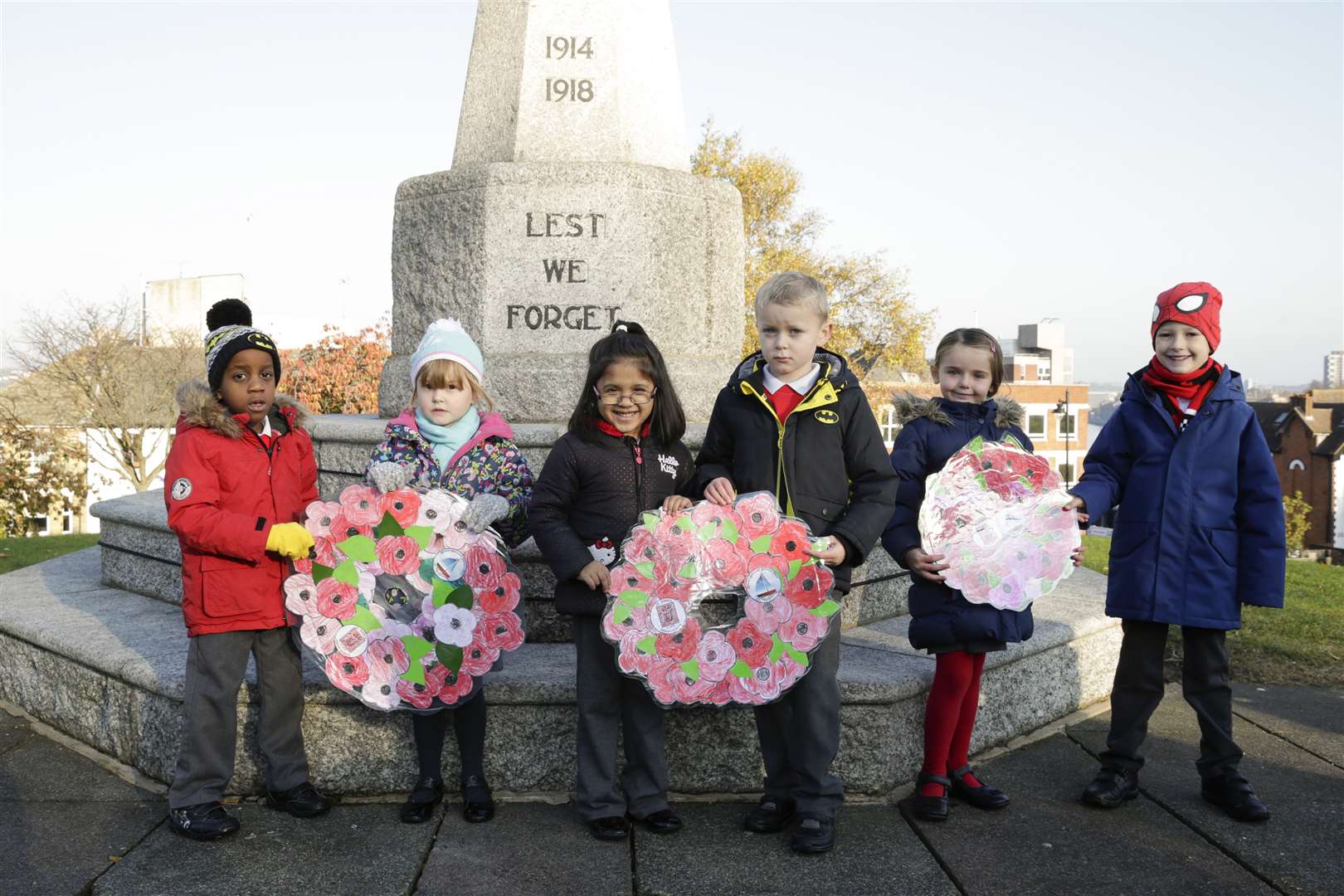 Children from St John's Church of England School in New Street, Chatham laying wreaths with parents, staff and soldiers at Victoria Gardens war memorial
