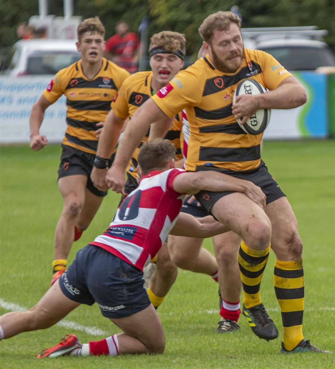 Canterbury's Tyler Oliver bids to keep his balance against Dorking. Picture: Phillipa Hilton