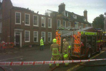 Crews assess the damage after a fire in West Malling. Picture: Martin Apps
