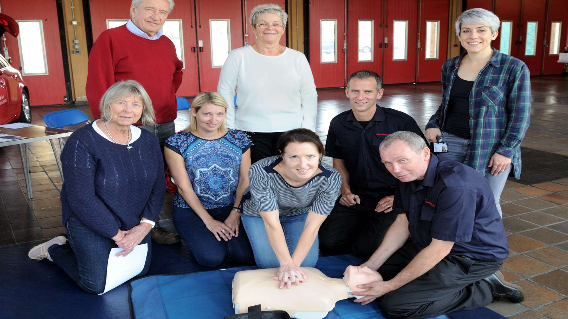 Sue and Alan Burgin, Louise Wells, Wendy Ring, Nicola Shooter, firefighters Kevin Griffith and Ashley Dring and paramedic Zoe Farley during CPR training