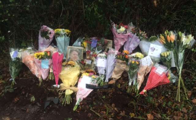 Floral tributes lay at the scene of the fatal crash in Ash Road, New Ash Green