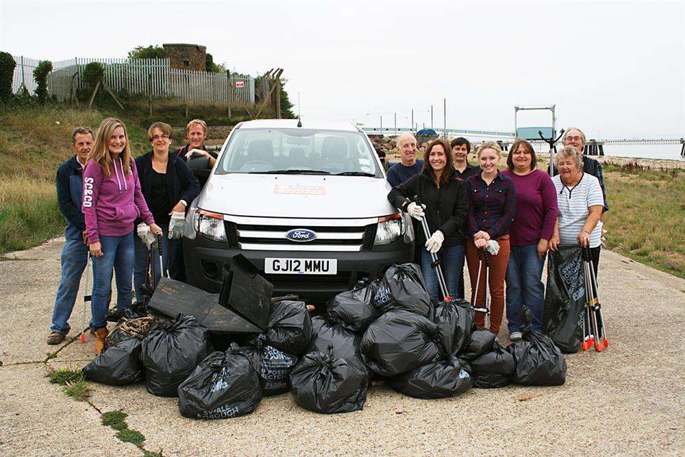 Volunteers and Swale council staff with the bags of waste collected during a clean-up of the beach at Garrison Point in Sheerness