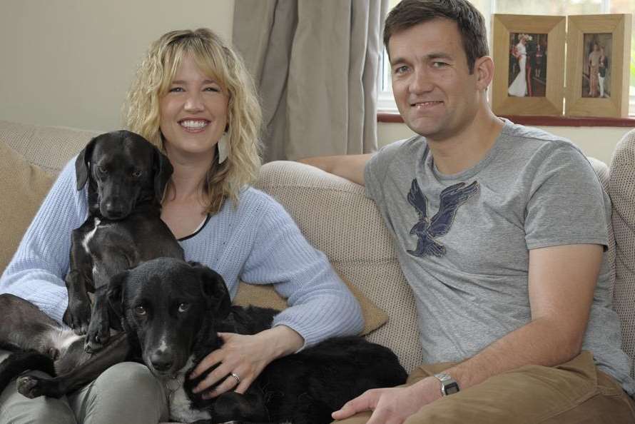 Danika and Stu Douglas at home in Brompton with their two rescue dogs Kara and Alen