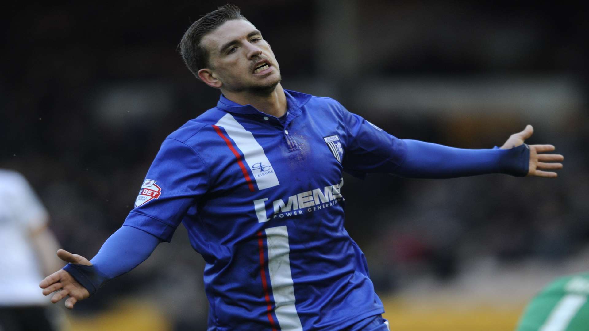 Cody McDonald celebrates scoring for Gillingham