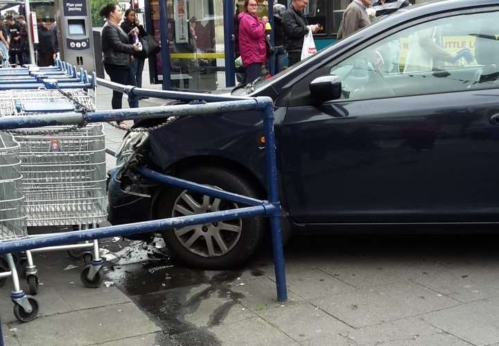 The car, thought to contain two people, crashed into the trolley bay for Tesco in New Road, Gravesend. Picture: Jayne Hollinsworth/Gravesend News