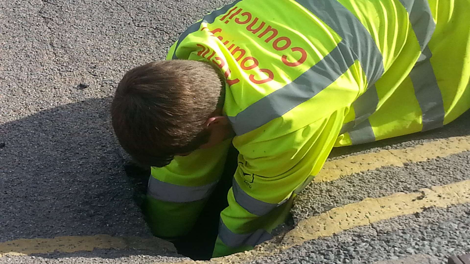 A council workman investigates