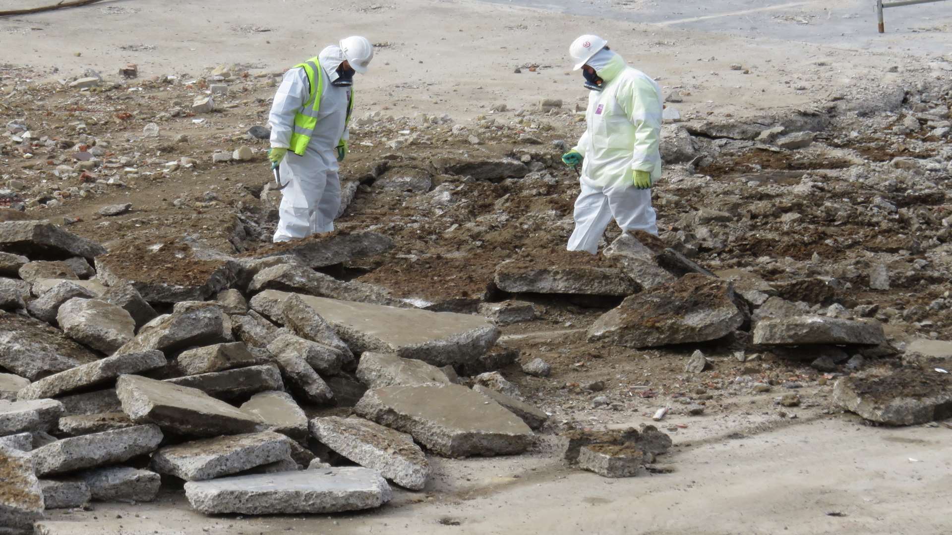 Contractors wearing white overalls have carried out soil tests on site. Photo by Andy Clark